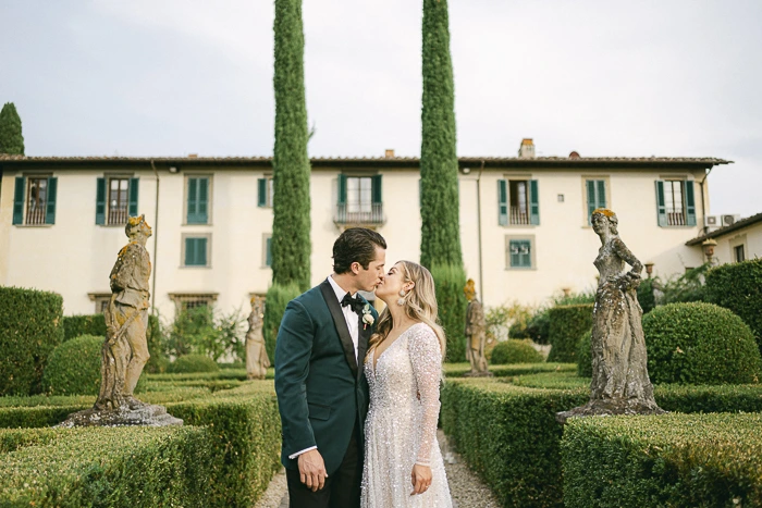 Tuscan wedding venue surrounded by vineyards and rolling hills at golden hour